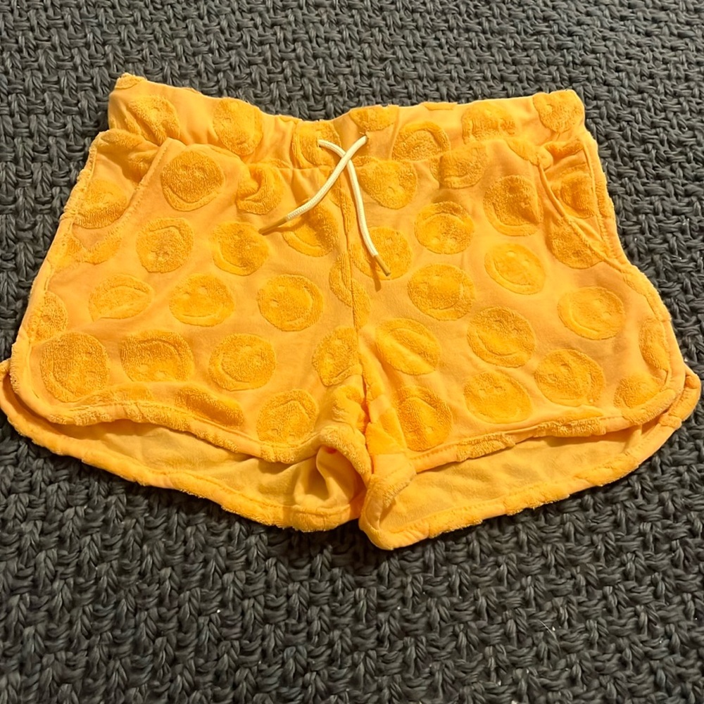 Orange smiley face shorts in size L (10/12)